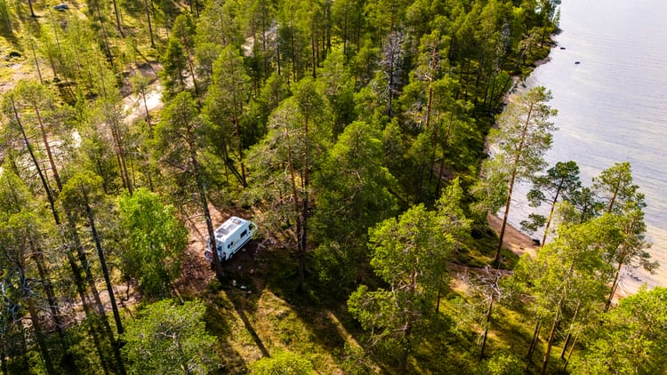 camper-van-nestled-in-finnish-lapland-forest-2026